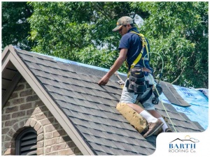 Man working on installing new roof in Tracy