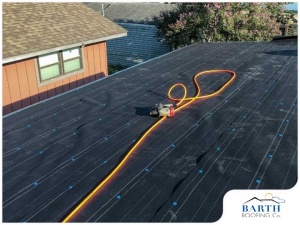 Repair of roof decking - picture of cord and equipment on top of roof